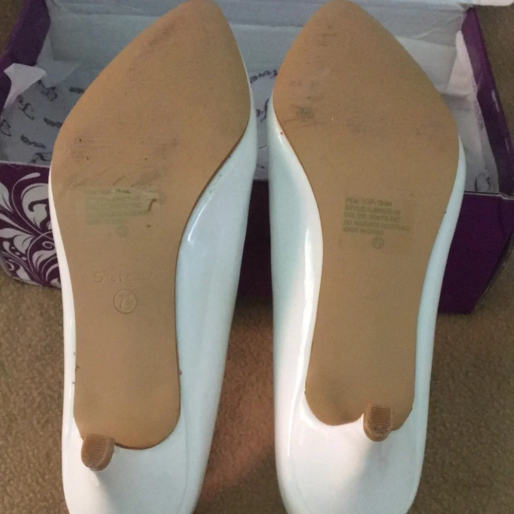 White patent pumps
